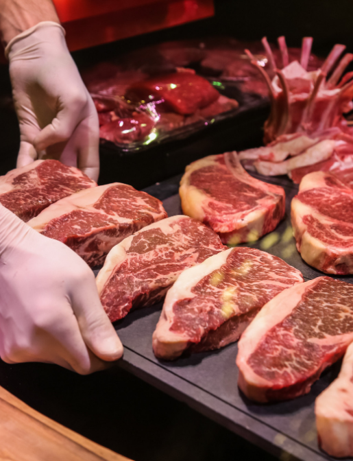 side-view-chef-makes-raw-marbled-beef-steaks-stand